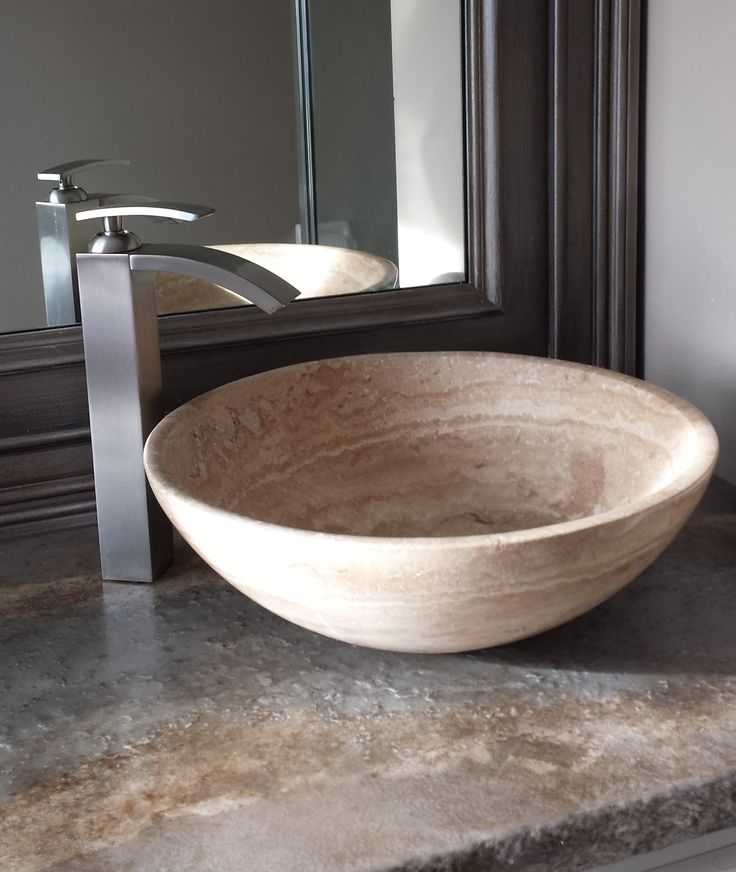 Vessel wash basins in stone or glass