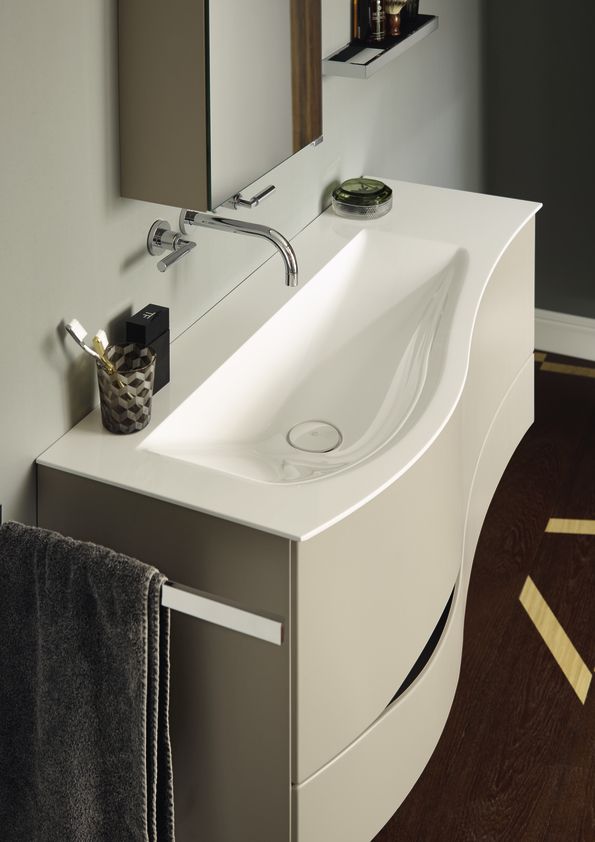 Asymmetrical designer wash basins